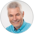Jürgen Beckmann, webgefährte, lächelt freundlich in einem blauen Hemd.